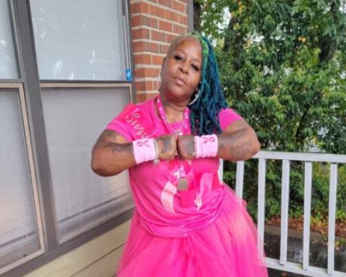 Lisette Davila wears pink as a breast cancer survivor thanking the doctors and staff at the UF Health Proton Therapy Institute
